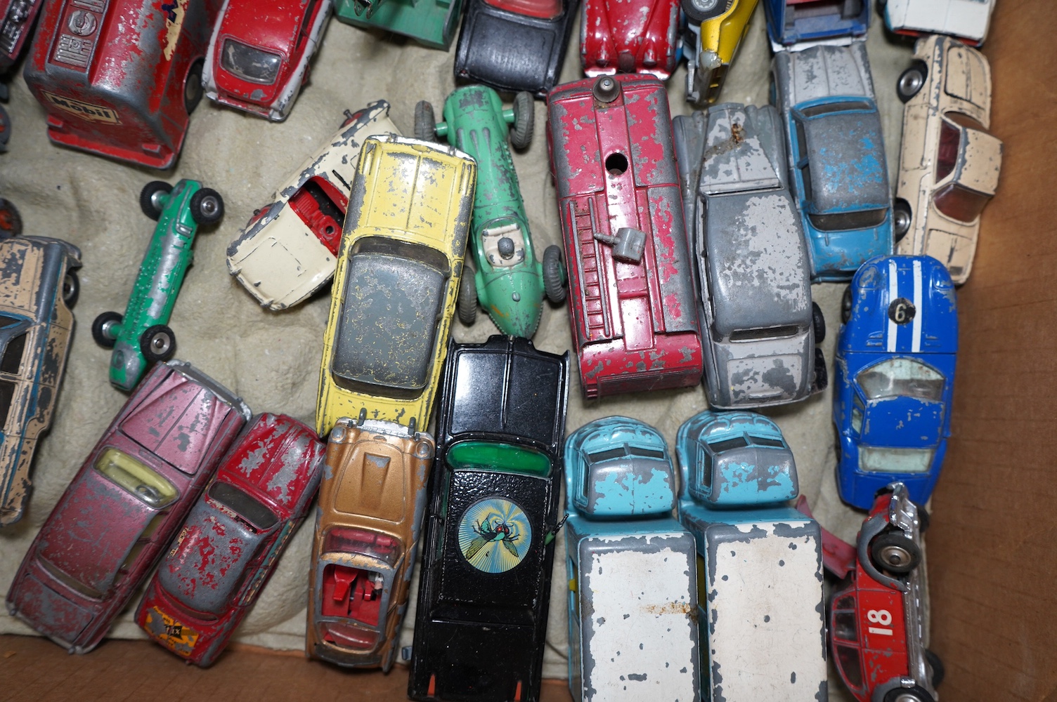 A collection of approximately ninety Dinky Toys, Corgi Toys, Matchbox Series, etc. for restoration, comprising of 1950s to 1970s diecast models of cars, commercial vehicles, military vehicles, etc. Condition - poor, most